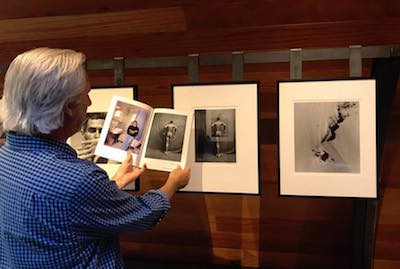 Visitor Holding Catalog while Viewing Edna's Work (Carol Henry Photo)