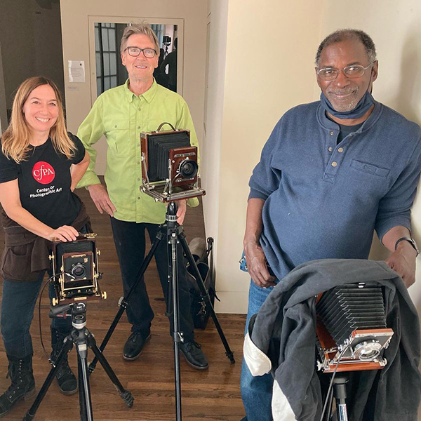 Ann, Chris, and Brian checking their 4x5 cameras for after lunch activity. Photo by Ken Parker